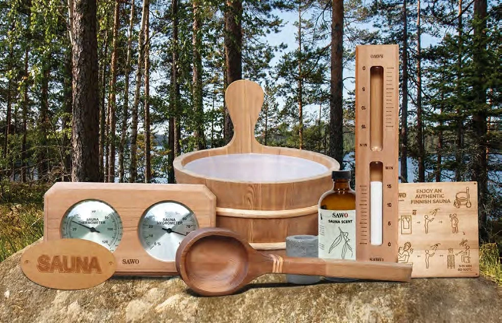 SAWO accessory set with aroma oils and a wooden signage board